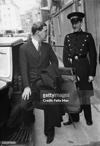 British fashion designer Norman Hartnell , with a doorman outside his Bruton Street salon in Mayfair, London, November 1938. Original Publication:...