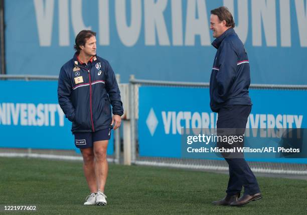 Luke Beveridge, Senior Coach of the Bulldogs and Chris Grant, Bulldogs Football Director chat during the Western Bulldogs AFL training session at...