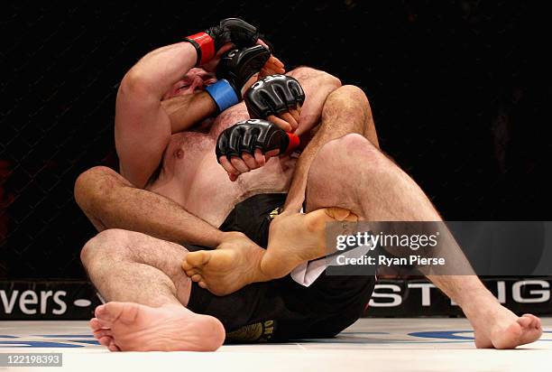 Mo Kandeel of Australia is pinned by Regan Wilson of Australia during their 84kg bout during CFC 18 at Luna Park on August 26, 2011 in Sydney,...