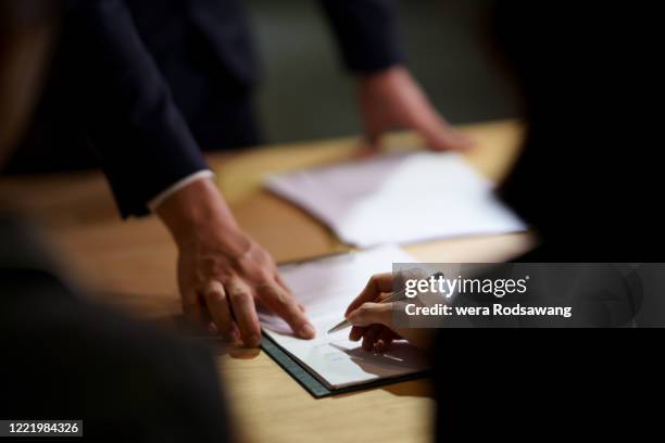 sign contract signature - deal signing stock pictures, royalty-free photos & images