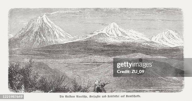 avachinskaya group, volcanoes on kamchatka, russia, wood engraving, published 1893 - siberia stock illustrations