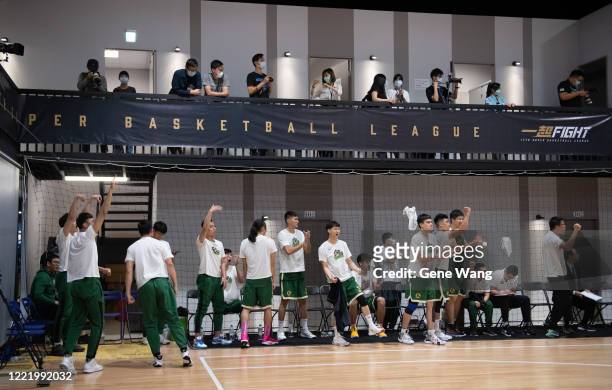 Players of Taiwan Beer cheer up at the court side during the SBL Finals Game Six between Taiwan Beer and Yulon Luxgen Dinos at Hao Yu Trainning...