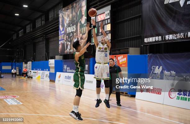 Chen Ju Lu of Yulon Luxgen Dinos attempts the shot during the SBL Finals Game Six between Taiwan Beer and Yulon Luxgen Dinos at Hao Yu Trainning...