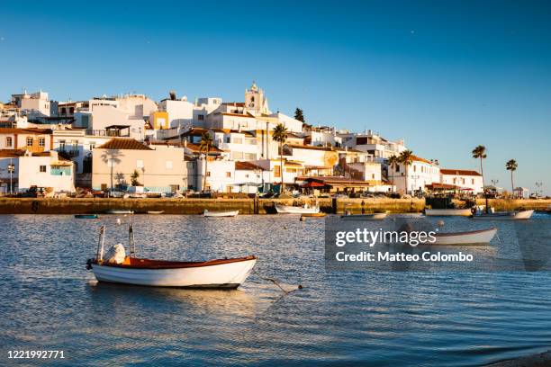 village and boats, ferragudo, algarve, portugal - faro city portugal foto e immagini stock