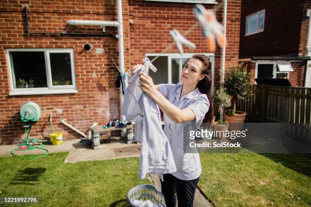 daily routine of a nurse - hanging clothes stock pictures, royalty-free photos & images