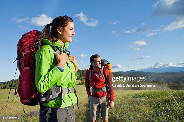 a couple hiking and camping. - woman rucksack stock pictures, royalty-free photos & images