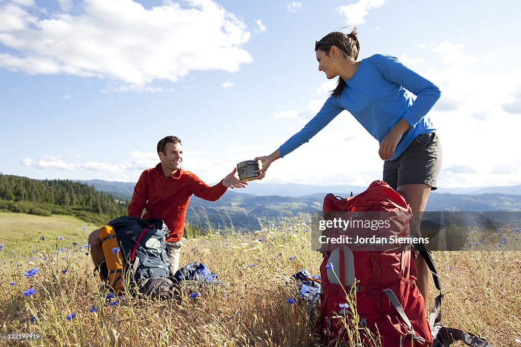 A couple hiking and camping.