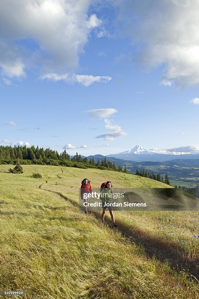 A couple hiking and camping.