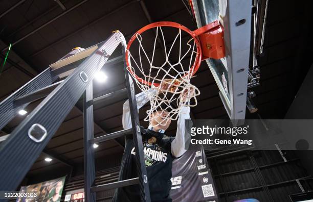 Manager Ta Tsung Chiu of Taiwan Beer cut the nets during the SBL Finals Game Six between Taiwan Beer and Yulon Luxgen Dinos at Hao Yu Trainning...