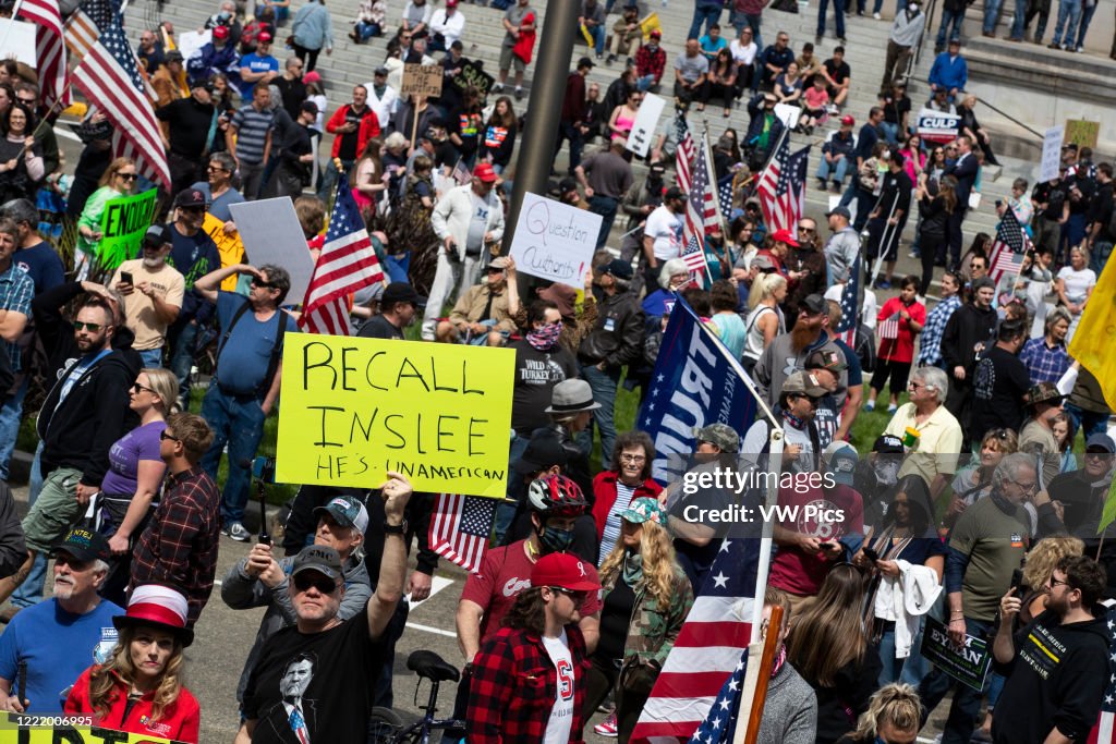 Restriction Stay A man holds a sign saying, ÒRecall Inslee,Ó at a protest against ...