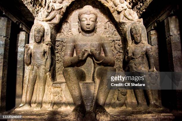 ellora cave 10, a 7th-century buddhist chaitanya hall, seated buddha sculpted with hands in the dharmachakra mudra, aurangabad, maharashtra, india - circa 7th century stock pictures, royalty-free photos & images
