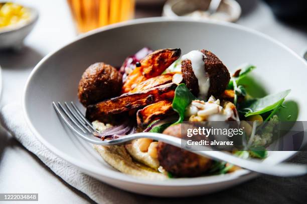 the ultimate mediterranean falafel bowl - middle eastern food stock pictures, royalty-free photos & images