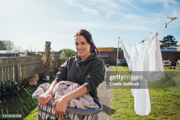 morning chores - washing basket stock pictures, royalty-free photos & images