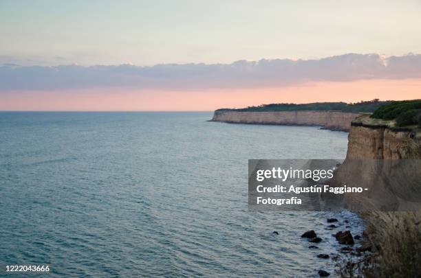 sunset at cliffs of mar del plata - mar del plata stock-fotos und bilder