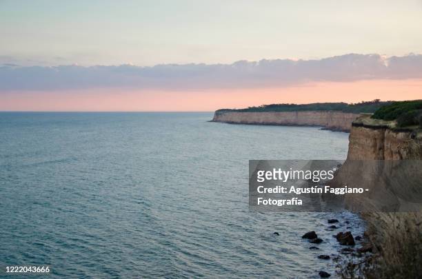 sunset at cliffs of mar del plata - mar del plata stock pictures, royalty-free photos & images