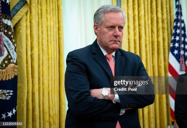 White House Chief of Staff Mark Meadows listens as U.S. President Donald Trump meets with New Jersey Gov. Phil Murphy in the Oval Office of the White...