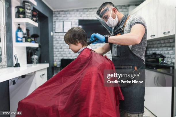 cute boy getting a haircut - lockdown haircut stock pictures, royalty-free photos & images