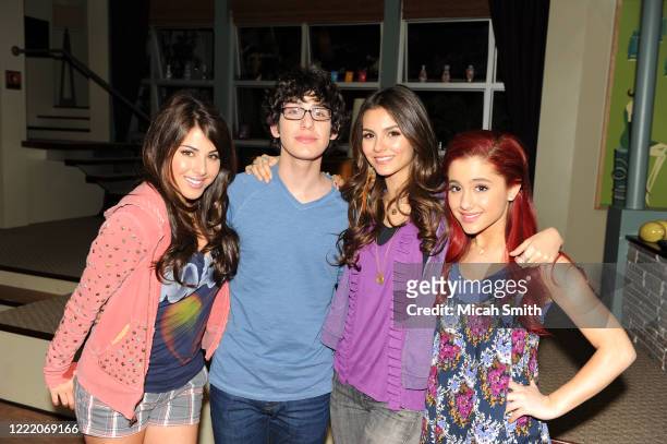 Daniella Monet, Matt Bennett, Victoria Justice and Ariana Grande actors pose for a portrait on the set of Victorious in Hollywood, California on...