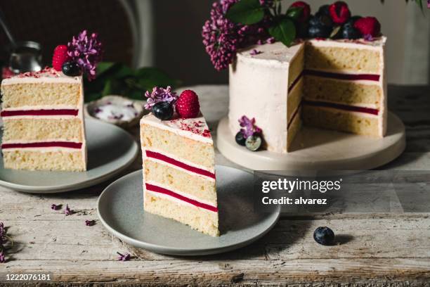 slice of a fruit flower cake - layer cake stock pictures, royalty-free photos & images