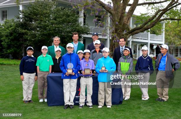 Defending Masters champion Adam Scott poses for a group photo with Boys 10-11 division competitors Shaheen Momin, Aidan Goldstein, Samuel Kodak, Leo...