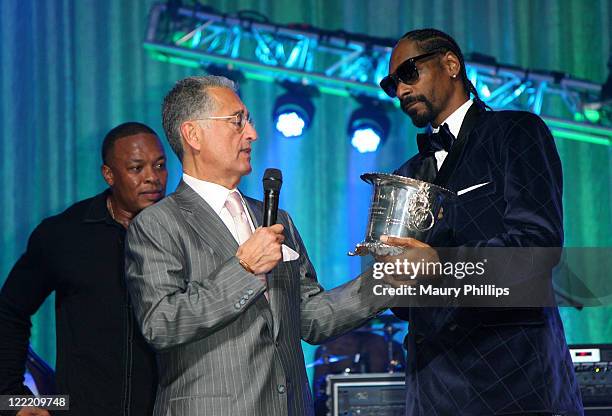 Rapper Dr. Dre BMI President and CEO Del Bryant and BMI 2011 Urban Awards Icon Snoop Dogg speak onstage during the 11th Annual BMI Urban Awards held...