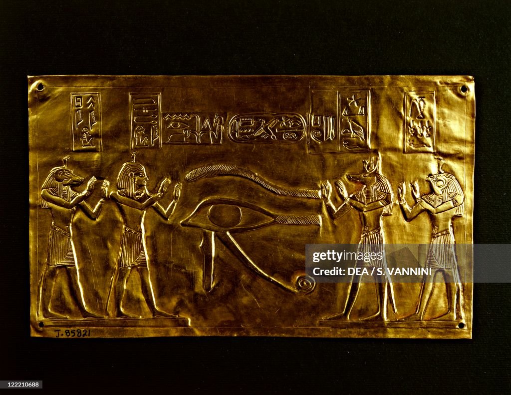 Gold plate for the mummy of Psusennes I. Relief representing Horus udjat eye and the four sons of Horus, Imset, Duamutef, Hapi, Qebehsenuef from Tanis, tomb of Psusennes I.