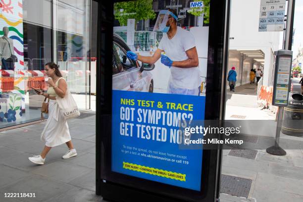 Government, Public Health England, NHS advertising boards advice to stay alert to the symptoms as part of the test and trace program as the...