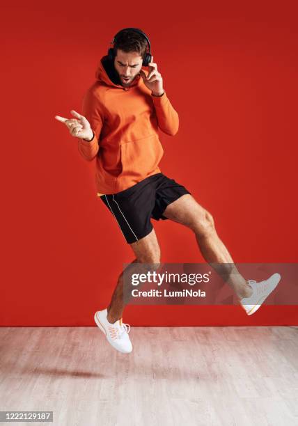 turn up the music and the endorphins - guy dancing music dynamic stock pictures, royalty-free photos & images