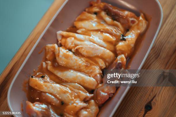 homemade gourmet food: roasting chicken thigh - marinate - marinated stock pictures, royalty-free photos & images