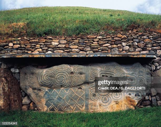Ireland - County Meath - Newgrange. Megalithic monument . Northwest side, engraved stone . Detail.