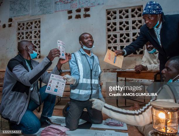 Electoral officials and political party monitors count votes during the presidential elections during the presidential elections at the Mighty Caspia...