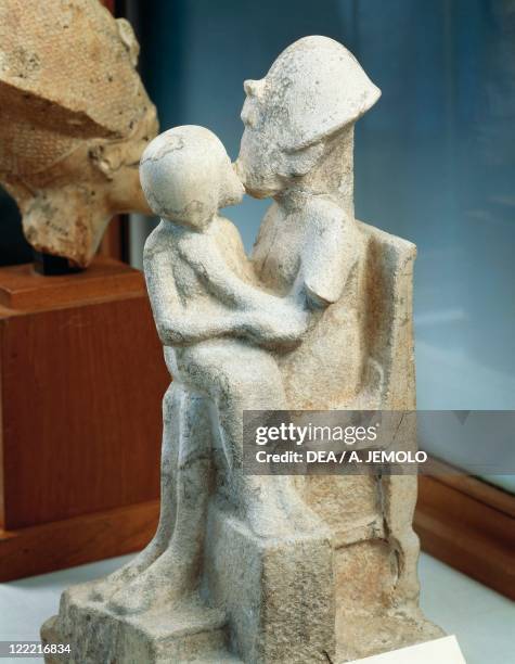 Egyptian civilization, Dynasty XVIII. Sculptural group of Akhenathon kissing his daughter. From Tell-el-Amarna.