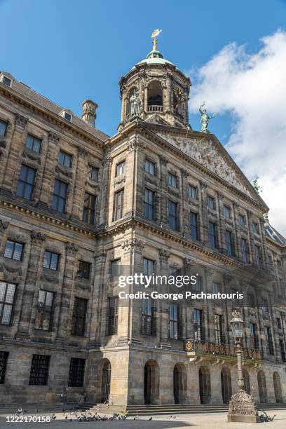 low angle view of the royal palace of amsterdam in dam square - amsterdam royal palace stock pictures, royalty-free photos & images