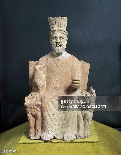 Punic civilization, 4th century b.C. Terracotta statuette of god Baal Hammon on the throne. From Thinissut .