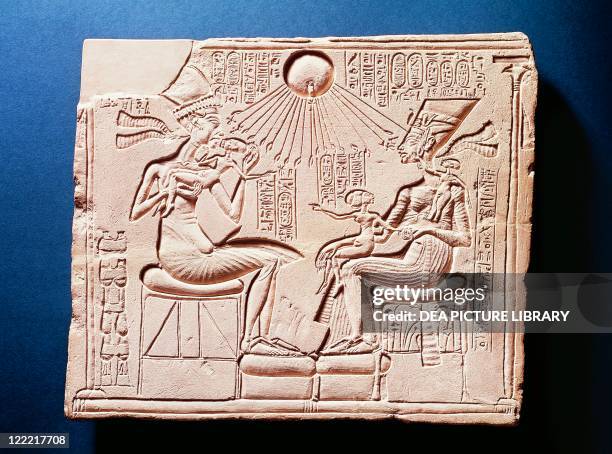 Egyptian civilization, New Kingdom, Dynasty XVIII. Relief portraying King Amenhotep IV with his wife Nefertiti and their children under the rays of...