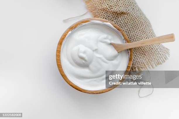 healthy breakfast with fresh greek yogurt on background - yogurt spoon stock-fotos und bilder