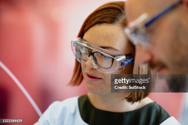working in the lab - biotechnology investment stock pictures, royalty-free photos & images