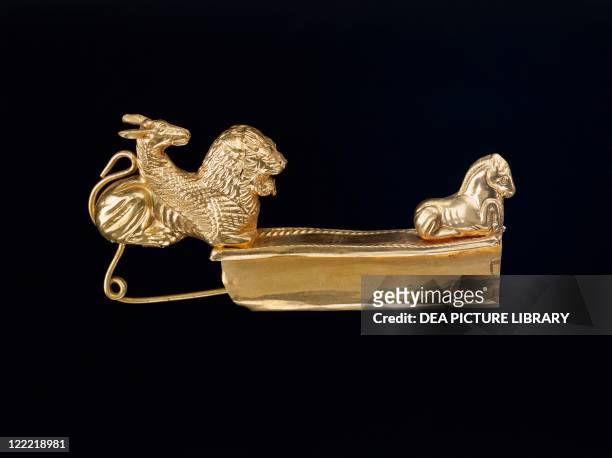 Etruscan civilization, 6th century b.C. Arched gold fibula with chimeras and horse.