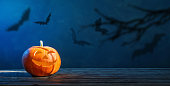 Halloween pumpkin on dark blue  background