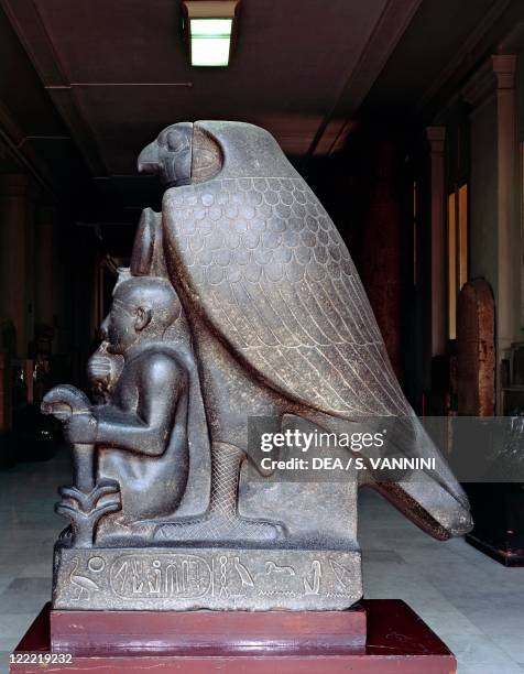 Egyptian civilization, New Kingdom, Dynasty XIX, Kingdom of Ramses II. Colossal statue of Ramses II as a child with god Horus, made of granitoid rock...