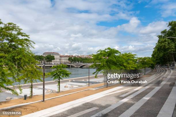 the rhone river docks are empty and closed, in the city center of lyon (guillotière district), france, due to coronavirus lockdown, april 2020 - lyon shopping stock pictures, royalty-free photos & images