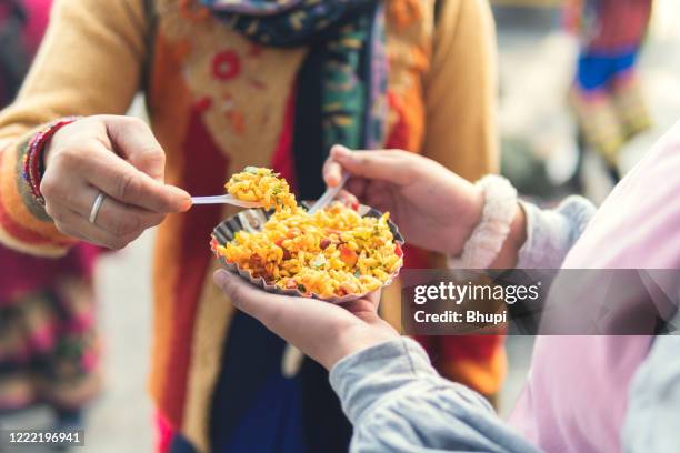 girls eating street food with enjoying. - street food stock pictures, royalty-free photos & images