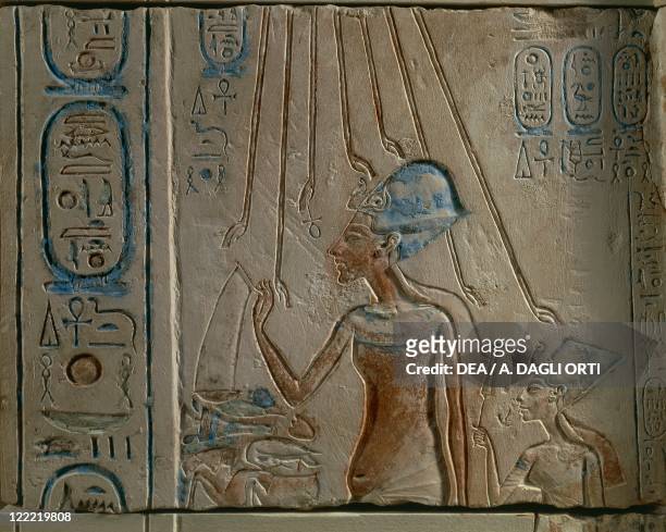 Egyptian civilization, New Kingdom, Dynasty XVIII. Akhenaten and Nefertiti worshipping the solar disc. From Tall al-Amarnah .