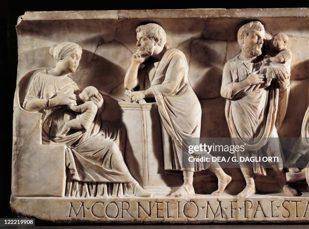 Roman civilization, 3rd century A.D. Sarcophagus of M. Cornelius Statius with scenes from his childhood. Detail: child with his parents.