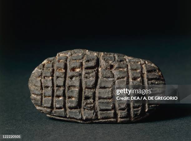 Prehistory, Italy. Oval stone pintadera . From the Caverna della Pollera, Finale Ligure, province of Savona.