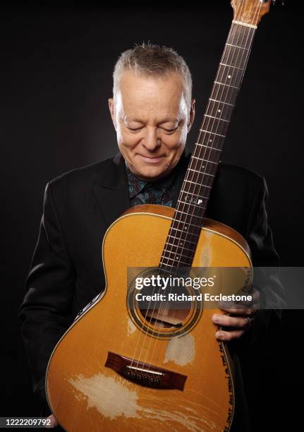 Tommy Emmanuel, Australian guitarist, United Kingdom, 2014. He is known for his complex fingerstyle technique, energetic performances and the use of...