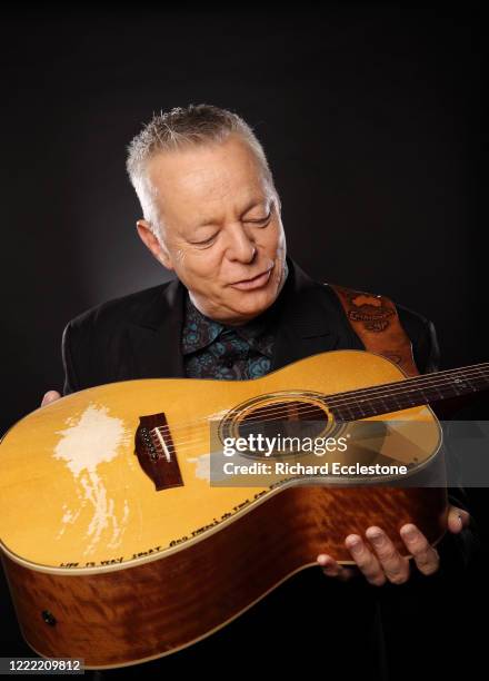 Tommy Emmanuel, Australian guitarist, United Kingdom, 2014. He is known for his complex fingerstyle technique, energetic performances and the use of...