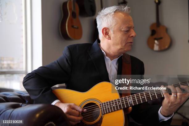 Tommy Emmanuel, Australian guitarist, United Kingdom, 2014. He is known for his complex fingerstyle technique, energetic performances and the use of...