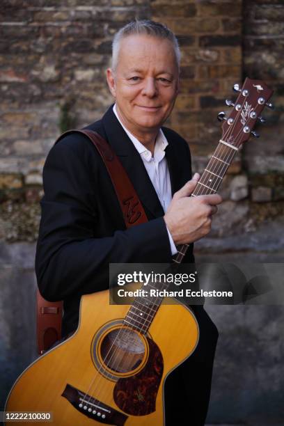 Tommy Emmanuel, Australian guitarist, United Kingdom, 2014. He is known for his complex fingerstyle technique, energetic performances and the use of...