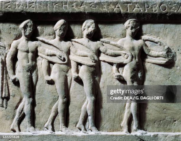 Greek civilization, 4th century b.C. - Marble relief depicting nude pyrrhic dancers. War dance.